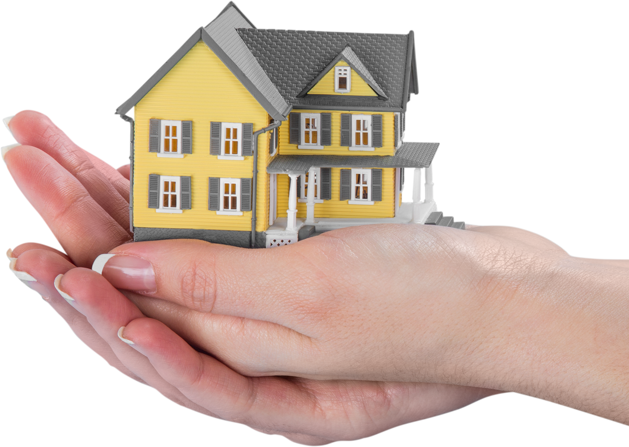 Hand Holding a Miniature House Model
